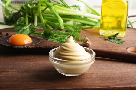 mayonnaise sour cream sauce on a wooden background cookingの写真素材