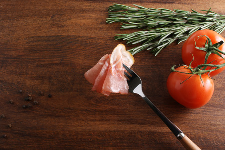 bacon sliced on a wooden backgroundの写真素材