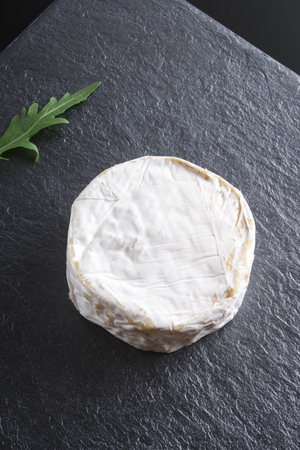 cheese brie stone background black darkの写真素材