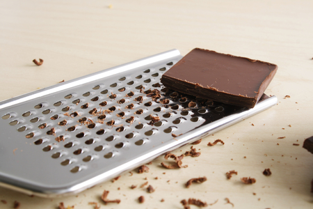 chocolate slices and graterの写真素材