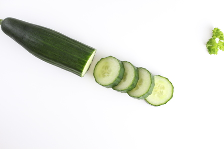 chop the cucumber on a white backgroundの写真素材