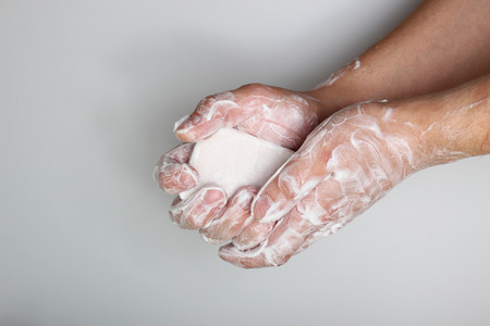 lather hands with soap