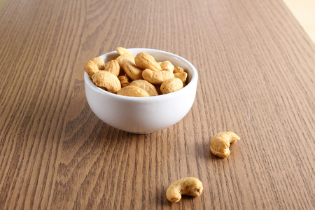 cashew nuts on wooden backgroundの写真素材