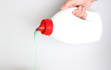 bottle of liquid detergent in handの写真素材