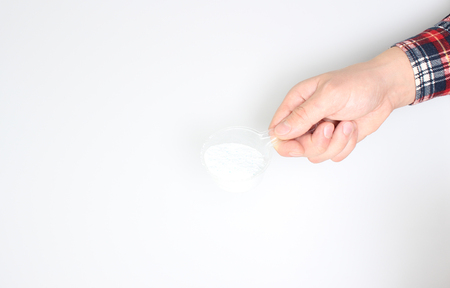 detergent powder pour on a light backgroundの写真素材