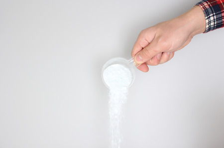detergent powder pour on a light background