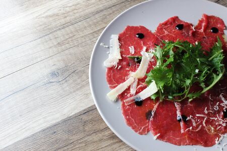 carpaccio on a wooden backgroundの写真素材