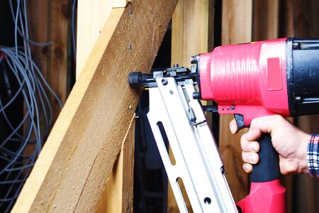 pneumatic nailing hand niler nails installation mount woodenの写真素材