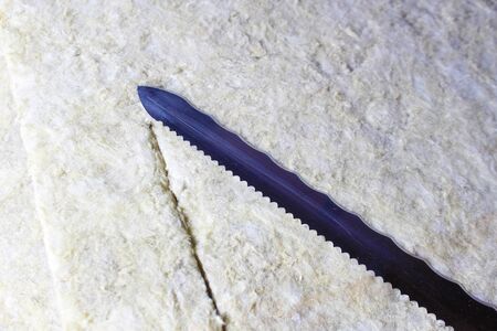 stone wool knife rock cut insulation rockwool isolationの写真素材