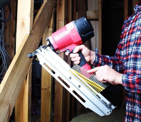 pneumatic nailing hand niler nails installation mount woodenの写真素材