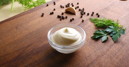 mayonnaise sour cream sauce on a wooden background cookingの写真素材