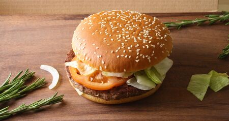 burger on a wooden backgroundの写真素材