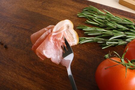 bacon sliced on a wooden backgroundの写真素材
