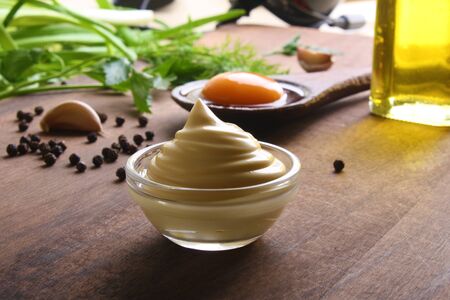 mayonnaise sour cream sauce on a wooden background cookingの写真素材