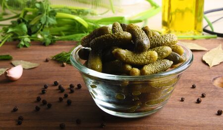 cucumber cornichons cuke on a wooden background cookingの写真素材
