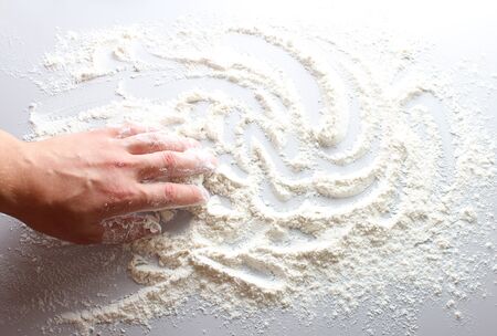 flour hand on a light backgroundの写真素材