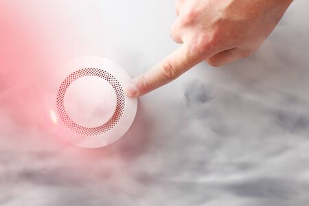 fire alarm and handの写真素材