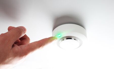 fire alarm and handの写真素材