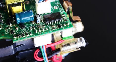 electronic circuit components on a black background