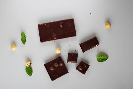 chocolate bar with hazelnut on a light background