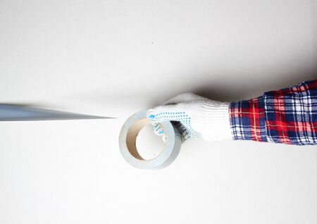 construction tape silver gloved handの写真素材