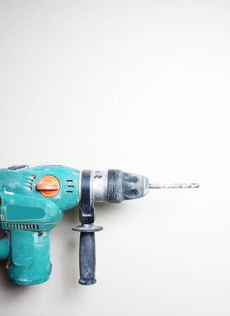 gloved hand drill hammer drill greenの写真素材