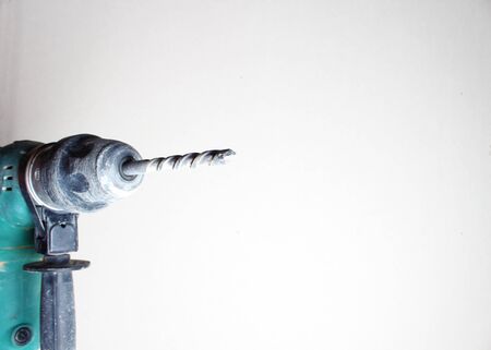 gloved hand drill hammer drill greenの写真素材