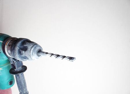 gloved hand drill hammer drill greenの写真素材