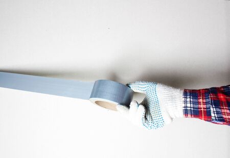 construction tape silver gloved handの写真素材