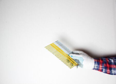 nails for construction gloved handの写真素材