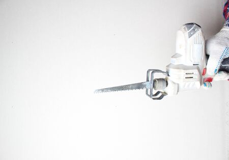reciprocating saw gloved hand builder batteryの写真素材