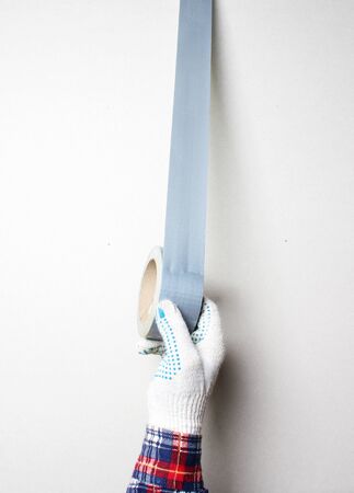 construction tape silver gloved handの写真素材