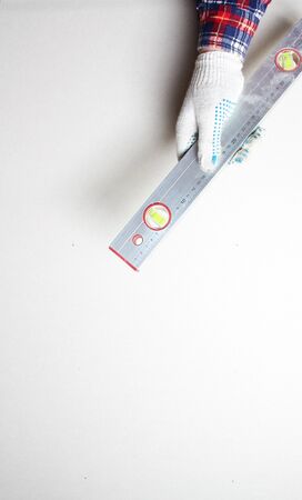 building level hand in glove on a light backgroundの写真素材