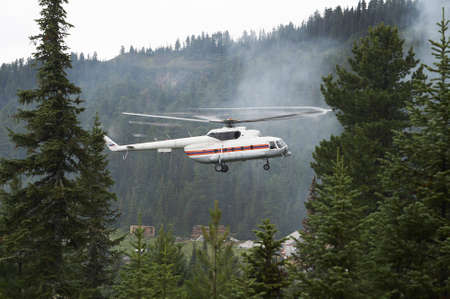 Rescue helicopter landing Hamar-Daban meteostation (Russian Federation, near Lake Baikal)の写真素材