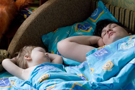 photo of sleeping child and his motherの写真素材