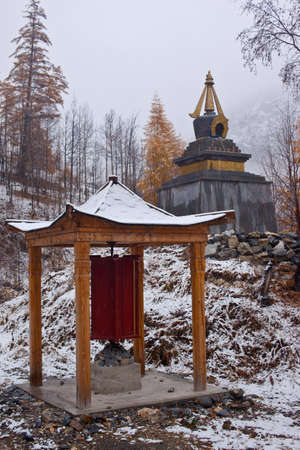 Photo of buddhist's pavilion and stupa. Snowfallの写真素材