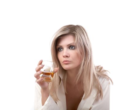 The girl with  glass of whisky on a white backgroundの写真素材