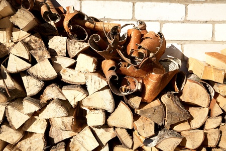 Stack of freshly cut fire wood shined with the sunの写真素材