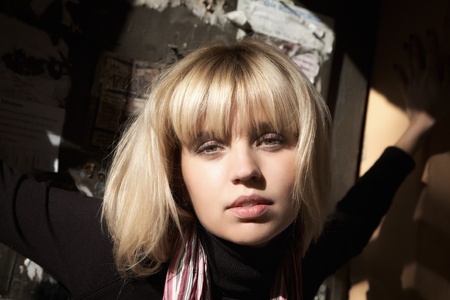 Girl's face close up shined with a sunlightの写真素材