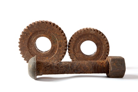 Rusty gears and bolt with a nut  on  white background isolatedの写真素材