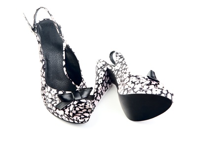 pair of female shoes on a high heel  white backgroundの写真素材