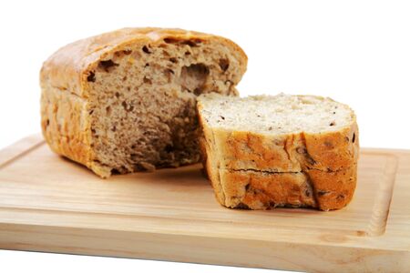 The cut loaf of bread with reflaction isolated on white