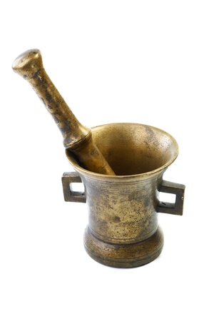 Brass mortar with a pestle isolated on a white backgroundの写真素材