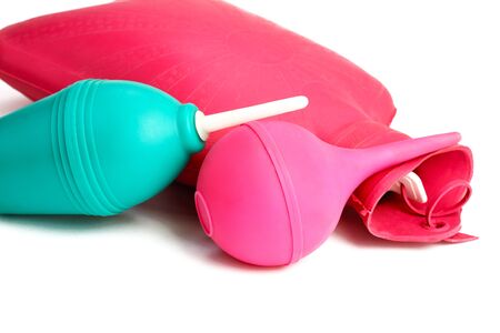 Medical hot-water bottle and colonic bulb for procedures on a white backgroundの写真素材