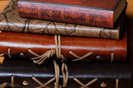 Pile of notebooks in leather covers close upの写真素材