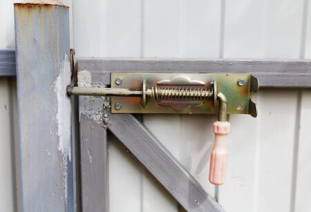 locking bolt on an iron fence