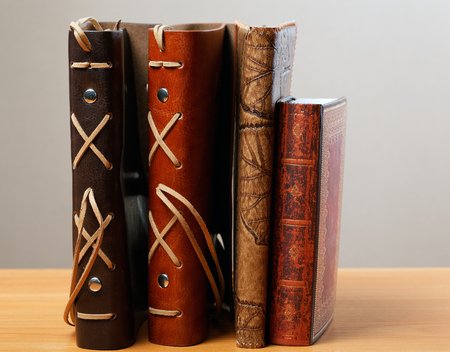 Pile of notebooks in leather covers close upの写真素材