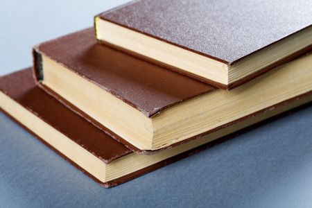 old books in brown cover close up