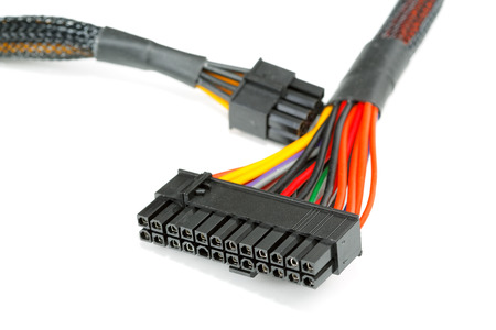 connecting wires to a computer on a white background