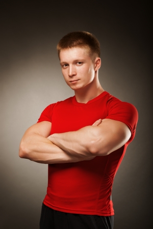 Healthy muscular young man  posing in studioの写真素材